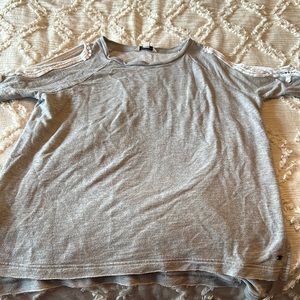 Arm cut out long sleeved top. Gently worn